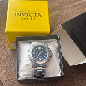 Invicta Silver and Black Timepiece